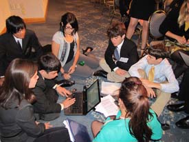 28. George Cortina, Andres Busse, and Michael Ruiz in LEGAL working on a position paper