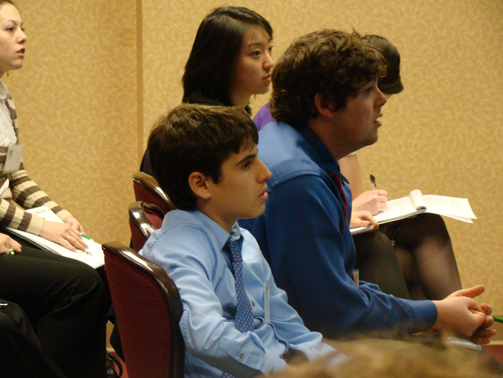 11.  Michael Ruiz listening to a fellow delegate make a case