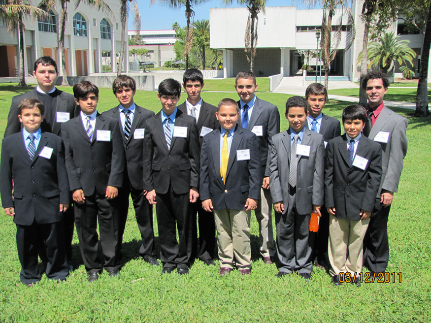 33 Jonathan Godoy stands proudly with delegates and their siblings
