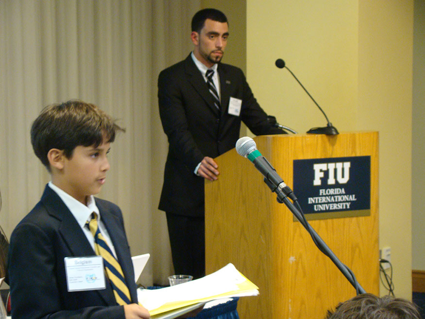 07 Sixth grader Adrian Torrebiarte addresses an  assembly of high school delegates