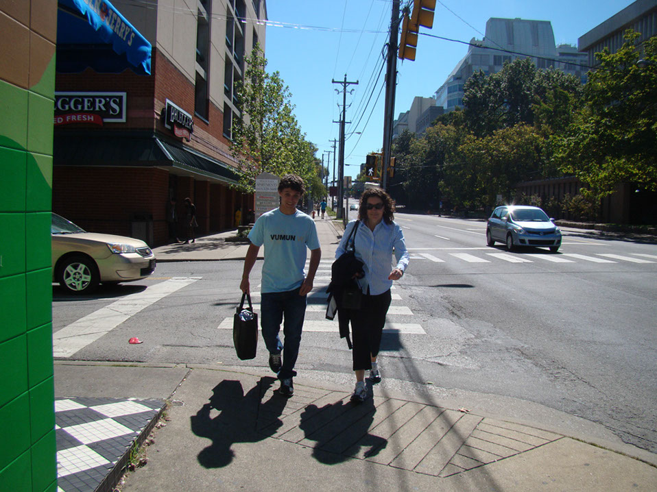 %_tempFileName6.3%20%20Alexander%20Vidal,%20awarded%20Best%20Delegates%20walks%20with%20Ms.%20Kenna%20downtown%